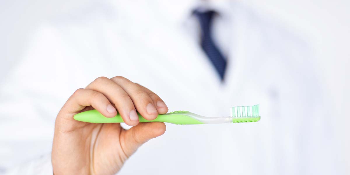 Woman flossing her teeth